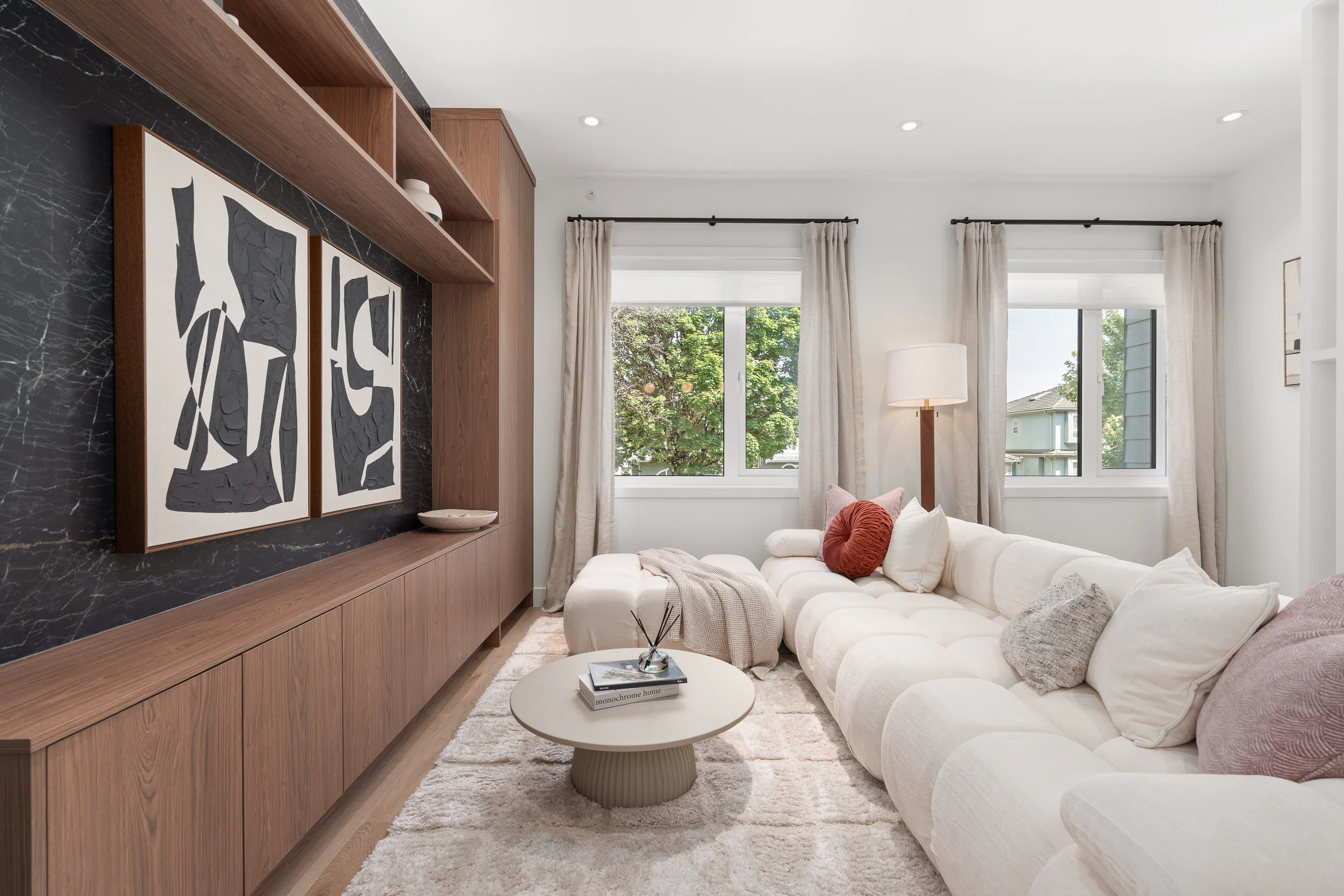 Sofa and coffee table in the Quintet show home living room, with the entertainment unit on the left
