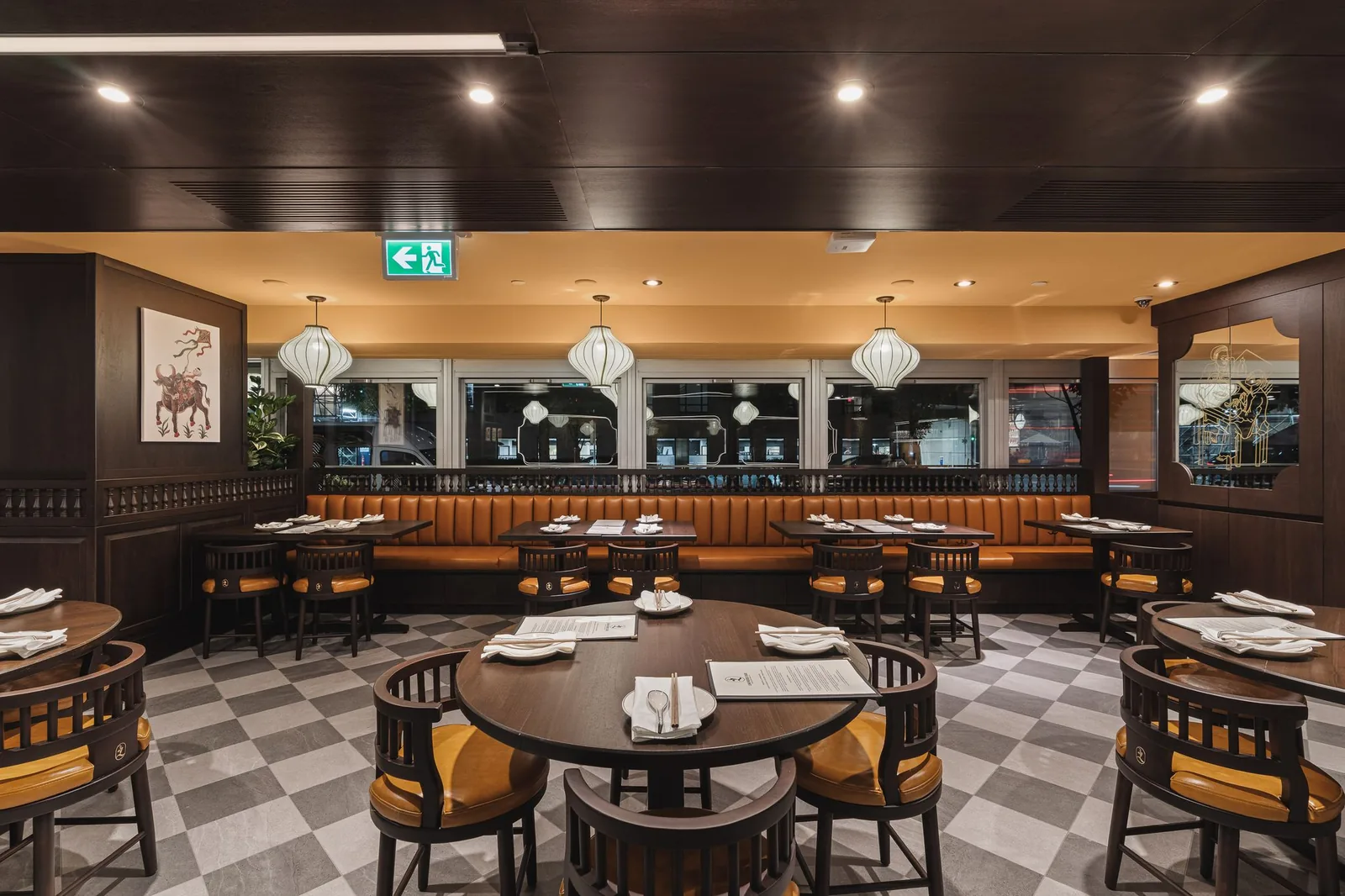 Dining room looking toward the windows, with a framed print and lanterns, Linh Noodle Bar by Costar Construction, Vancouver