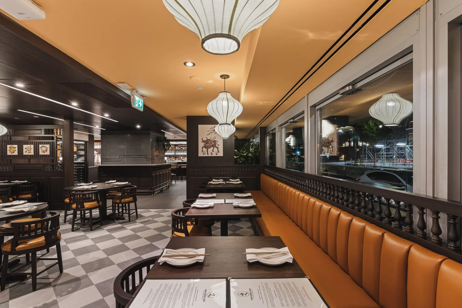 Long booth along the windows, looking toward the bar, Linh Noodle Bar by Costar Construction, Vancouver
