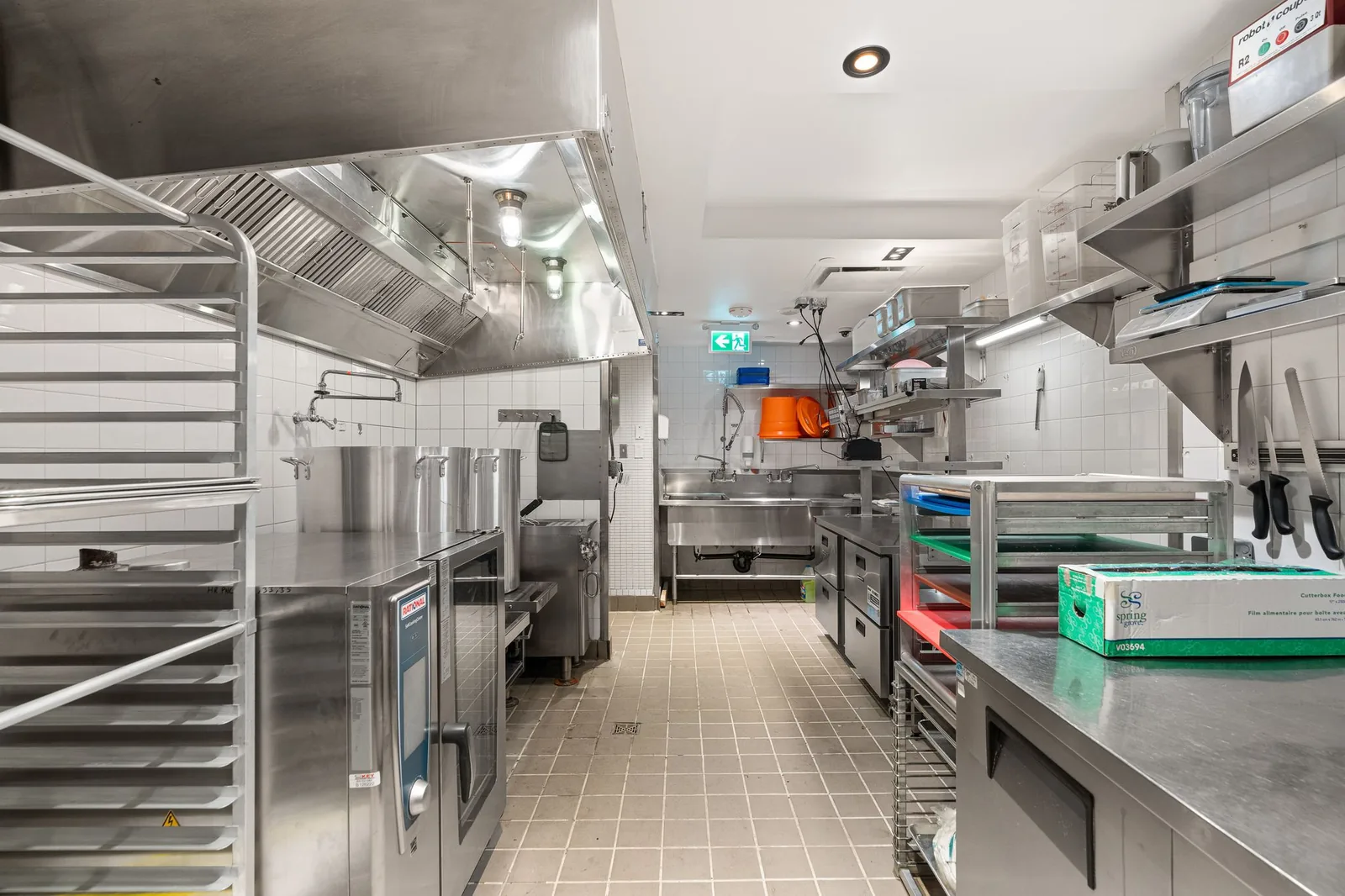 Kitchen with sheet pan racks, prep tables and a knife rail, Linh Noodle Bar by Costar Construction, Vancouver