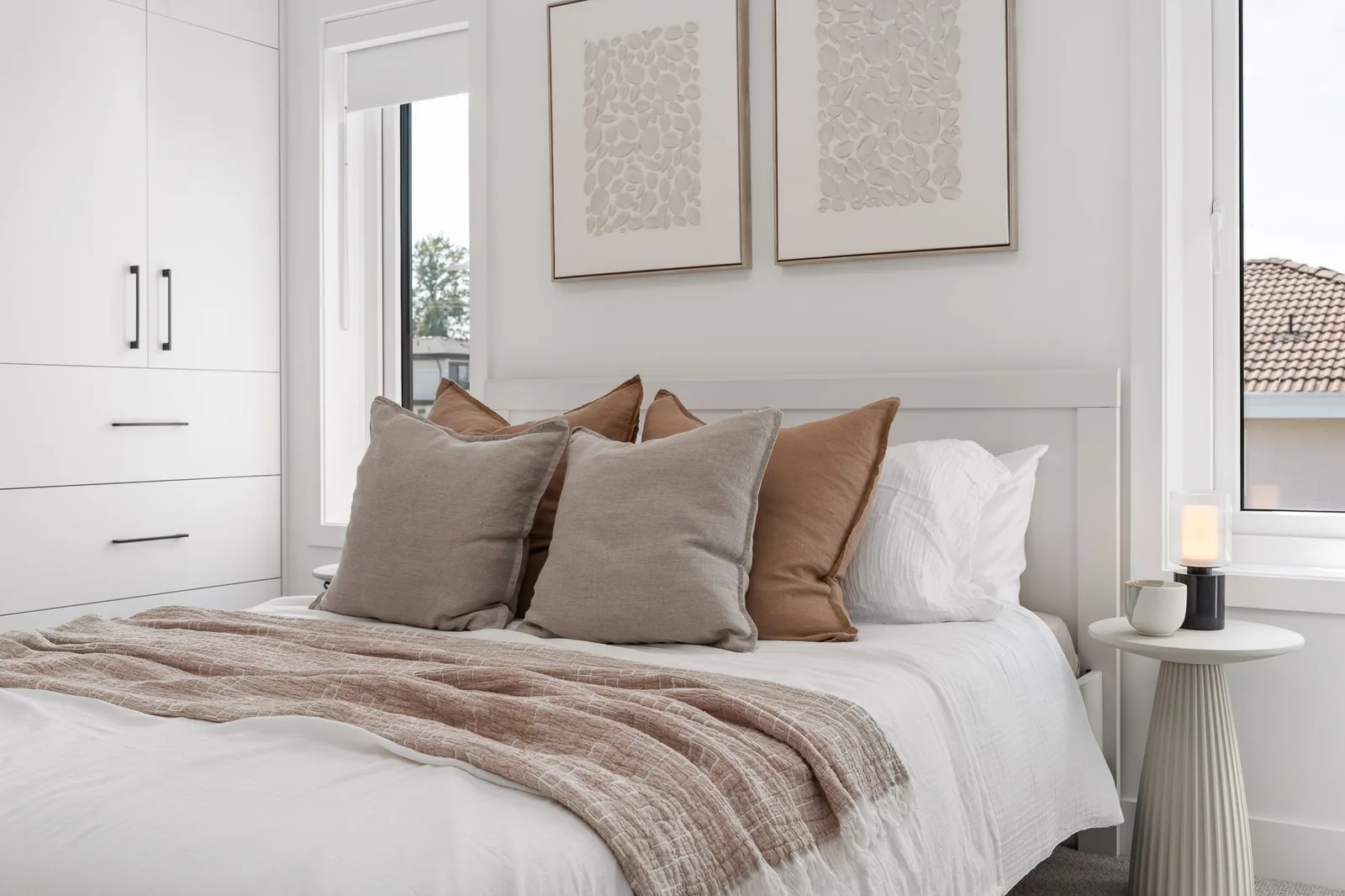 Bedroom in the Quintet show home with wool carpet, white built-in wardrobes and two windows