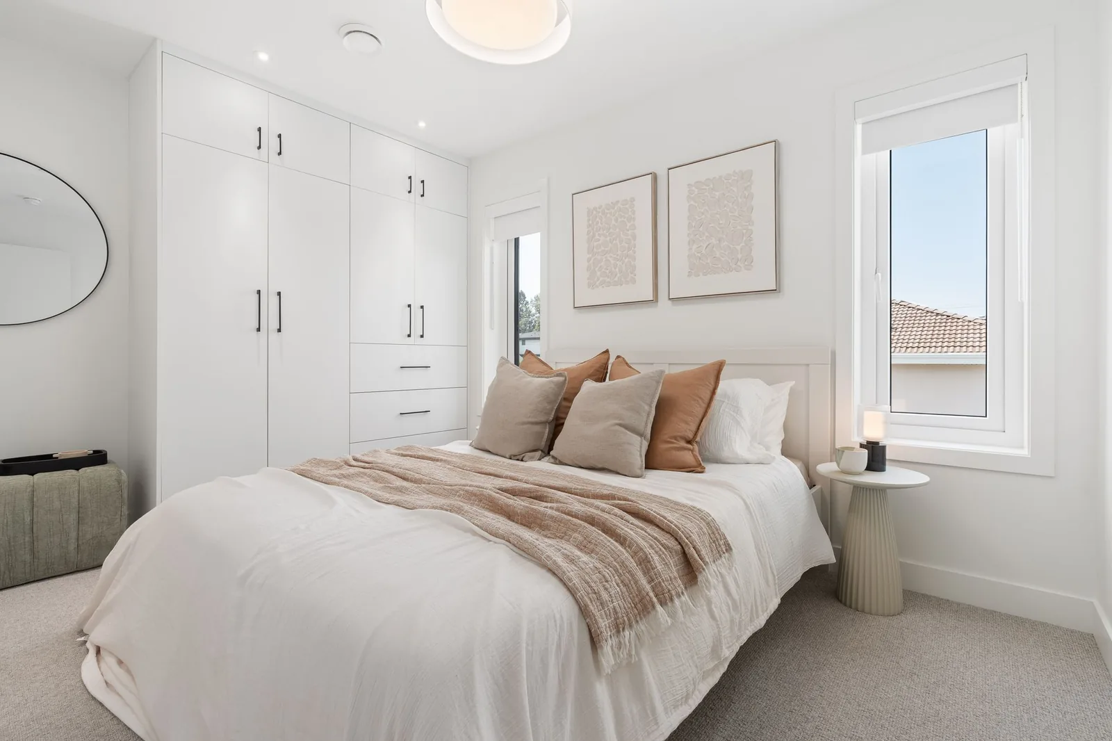 Bedroom in the Quintet show home with a wall of white built-in closets
