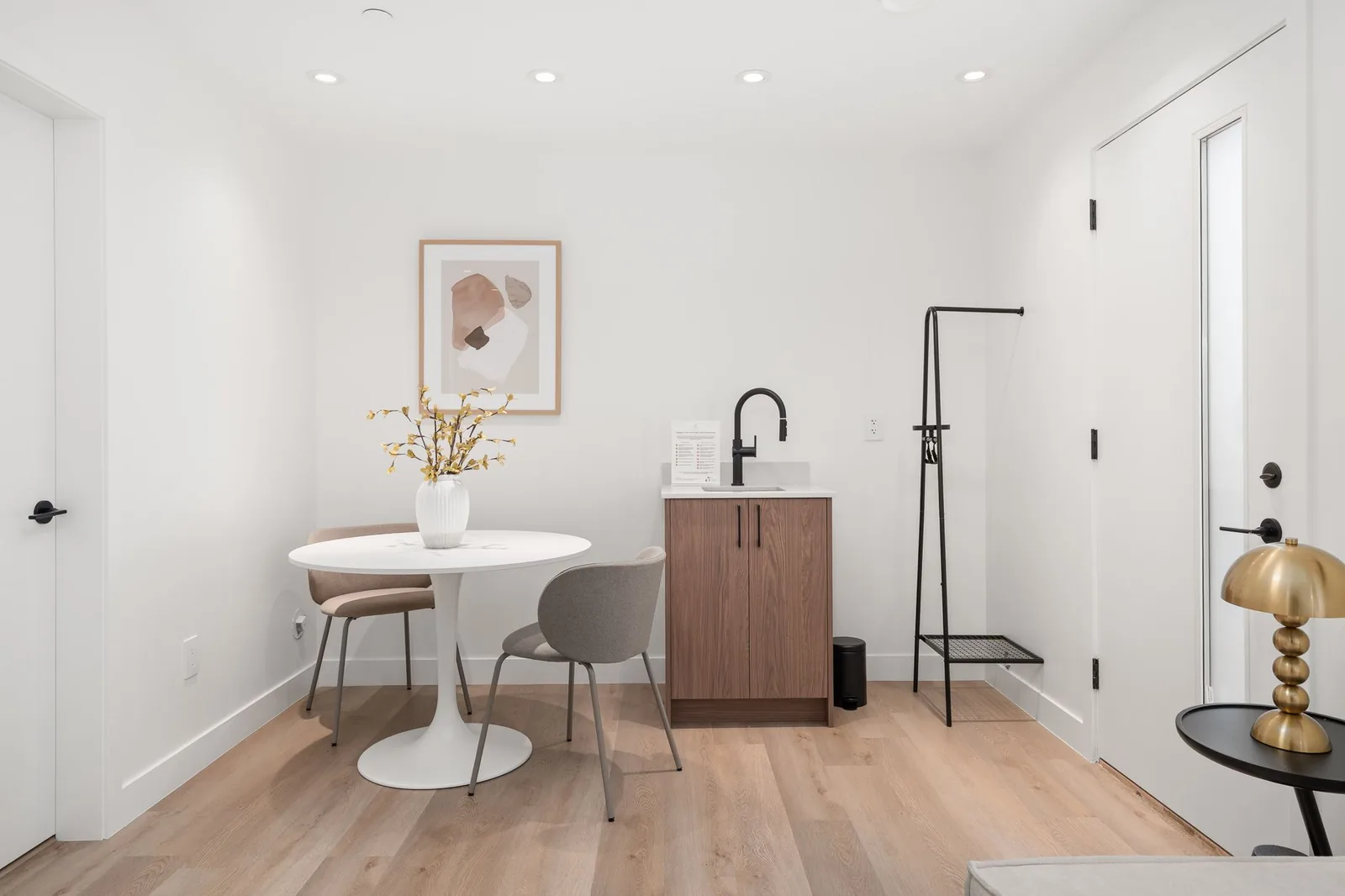 Wet bar and dining nook in a Quintet ground-floor suite, beside the suite entrance
