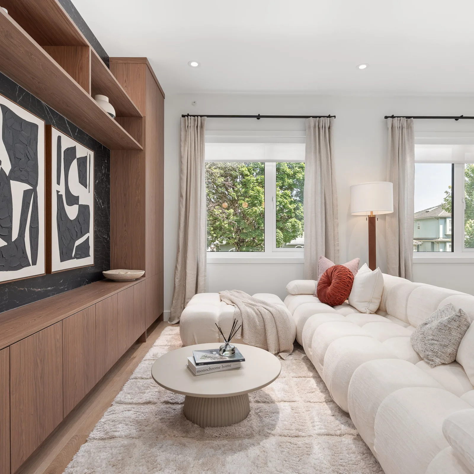 Sofa and coffee table in the Quintet show home living room, with the entertainment unit on the left